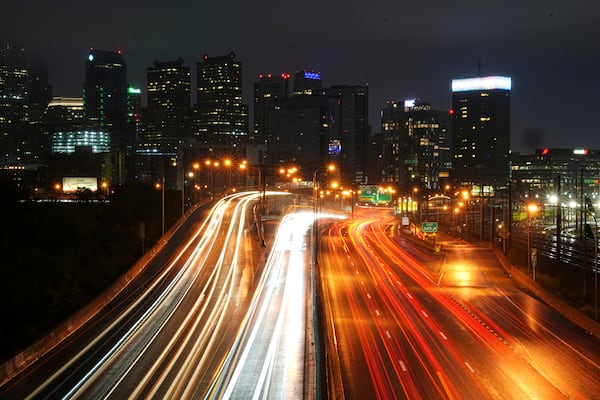 In this long exposure photograph traffic moves along Interstate 76 ahead of the Memorial Day holiday weekend, in Philadelphia, Thursday, May 22, 2025. (AP Photo/Matt Rourke)