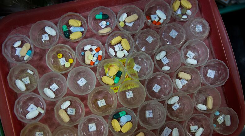 Pills are prepared for HIV/AIDS patients. (Photo by Taylor Weidman/Getty Images)