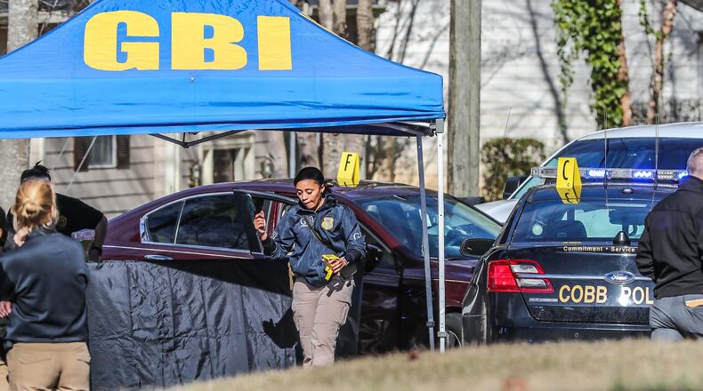 GBI agents continued their investigation into a deadly officer-involved shooting near Powder Springs.