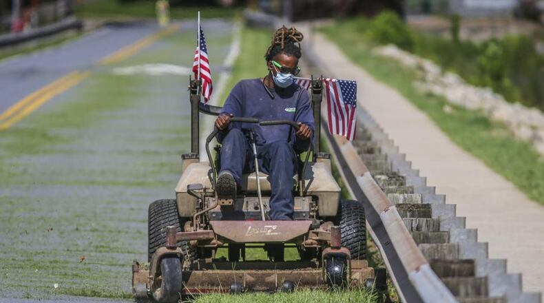 Fayette County has revised its 2018 grass-mowing plan to improve maintenance along major highways. AJC file photo