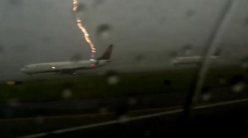 A freeze frame shows the moment lightning struck a Delta Air Lines plane in Atlanta on Tues., Aug. 18, 2015. (Credit: YouTube)