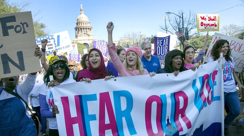 (USE THIS PHOTO LEAD) Former Texas State Senator Wendy Davis, center dressed infall pink, leads the women’s movement as thousands attended the Women’s March on Austin Saturday afternoon January 21, 2017, joining other movements across the country to stands up for women’s rights. RALPH BARRERA/AMERICAN-STATESMAN