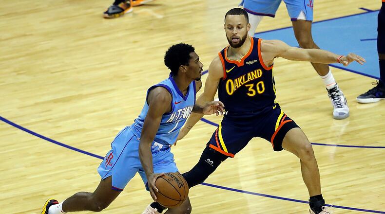 The Golden State Warriors' Stephen Curry (30) defends against the Houston Rockets' Armoni Brooks during the second quarter at Toyota Center in Houston on Saturday, May 1, 2021. (Bob Levey/Getty Images/TNS)