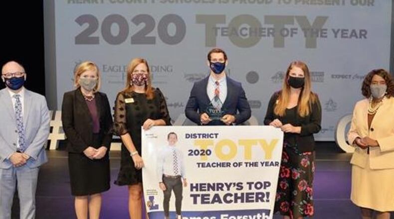 James Forsythe (center) with (from left) Luella High principal Jerry Smith, district superintendent Mary Elizabeth Davis, and Board of Education members Holly Cobb, Sophe Pope and Annette Edwards.