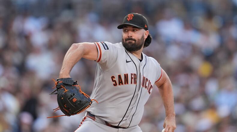 San Francisco Giants starting pitcher Robbie Ray works against a San Diego Padres batter during the first inning of a baseball game Thursday, July 30, 2026, in San Diego. (AP Photo/Gregory Bull)