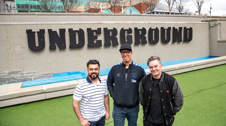 Underground CEO Shanel Lalani, from left, works with the MJQ owners Ryan Murphy and Ryan Purcell, to continue developing Underground Atlanta with MJQ moving to the Dante's Down the Hatch space, which has been sitting empty for 25 years. MJQ owners are sharing a little of what is in the planning stages on Monday, Feb 27, 2023. (Jenni Girtman for The Atlanta Journal-Constitution)