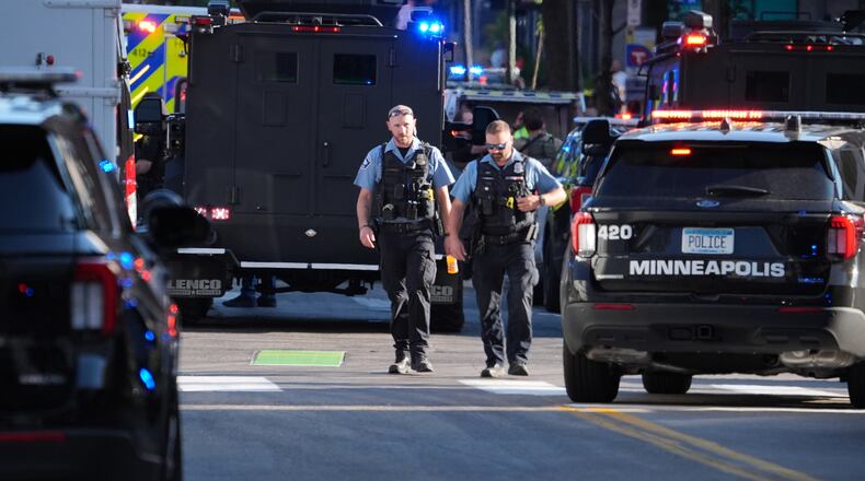 Police respond to a shooting Wednesday, Sept. 2, 2026, in downtown Minneapolis. (AP Photo/Ellen Schmidt)
