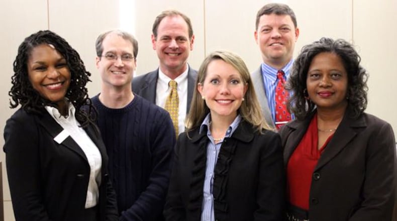 Decatur’s school board,l-r, Tasha White, Co-Chair Garrett Goebel, Lewis Jones, Chair Annie Caiola, Superintendent David Dude and Bernadette Seals. Board members, not counting Dude, make $50 per meeting. Though three seats are up for election—Jones and Caiola, with Seals retiring—only one candidate qualified. Courtesy City Schools Decatur
