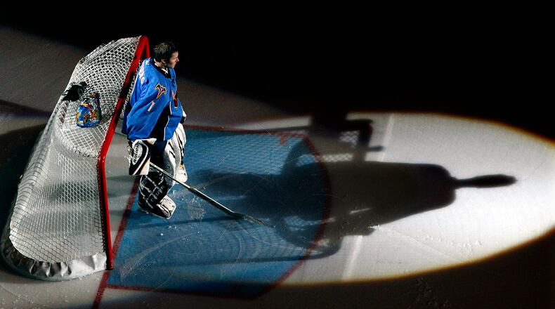 Atlanta Thrashers goalie Johan Hedberg is hit by a spot light as he warms up for a game at Philips Arena in Atlanta on Monday, Nov. 30, 2009.  Curtis Compton ccompton@ajc.com