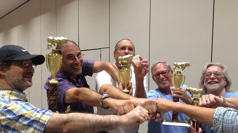 Members of kosher barbecue team Meatzvah Men gather after prepping their food at B’Nai Torah in Sandy Springs. The team competed in the fourth annual Atlanta Kosher Barbecue competition on Sept. 25. From left: Steve Kaufman, Mitch Frank, Kirk Pardue, Stan Schnitzer, Jeff Marlowe. LIGAYA FIGUERAS / LIGAYA.FIGUERAS@AJC.COM