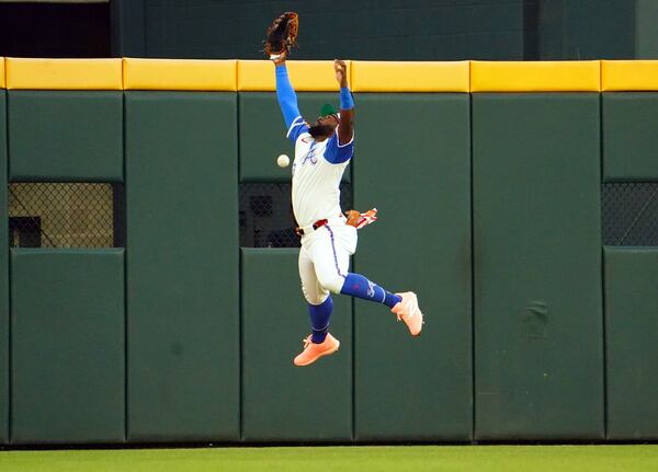 Atlanta Braves outfielder Michael Harris II (23) misses a fly ball against the Minnesota Twins during the third inning in a baseball game at Truist Park, Saturday, April 19, 2025, in Atlanta. (AP Photo/ John David Mercer)