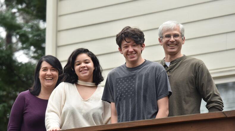 Tom and Debbie Crittenden didn’t start the fostering and adoption process expecting to raise two teenagers, but that changed when they met Lexy and Mark, whom they later adopted. They’re shown at their home in Smyrna in January. Teens and siblings in foster care are the hardest to find permanent homes for, and the longer children are in foster care, the harder it is to get adopted. HYOSUB SHIN / HYOSUB.SHIN@AJC.COM