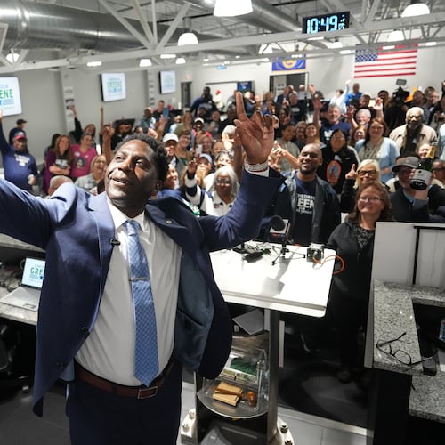 Chedrick Greene, Democratic candidate for 35th Senate District, takes a selfie with supporters after speaking Tuesday, May 5, 2026 in Saginaw, Mich. (AP Photo/Paul Sancya)