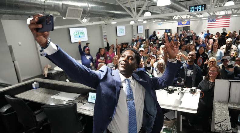 Chedrick Greene, Democratic candidate for 35th Senate District, takes a selfie with supporters after speaking Tuesday, May 5, 2026 in Saginaw, Mich. (AP Photo/Paul Sancya)