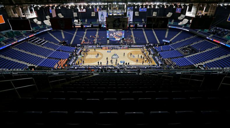 Greensboro Coliseum is mostly empty after the NCAA college basketball games were cancelled at the Atlantic Coast Conference tournament in Greensboro, N.C., Thursday, March 12, 2020. The biggest conferences in college sports all canceled their basketball tournaments because of the new coronavirus, seemingly putting the NCAA Tournament in doubt. (AP Photo/Gerry Broome)