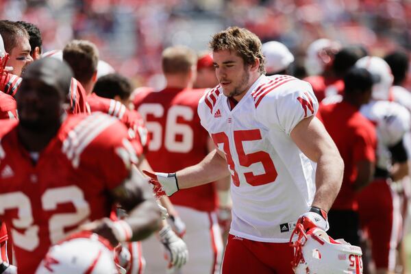 FILE - Nebraska's Andy Janovich greets teammates before the annual Nebraska Red-White NCAA college football spring game in Lincoln, Neb., Saturday, April 6, 2013. (AP Photo/Nati Harnik, File)