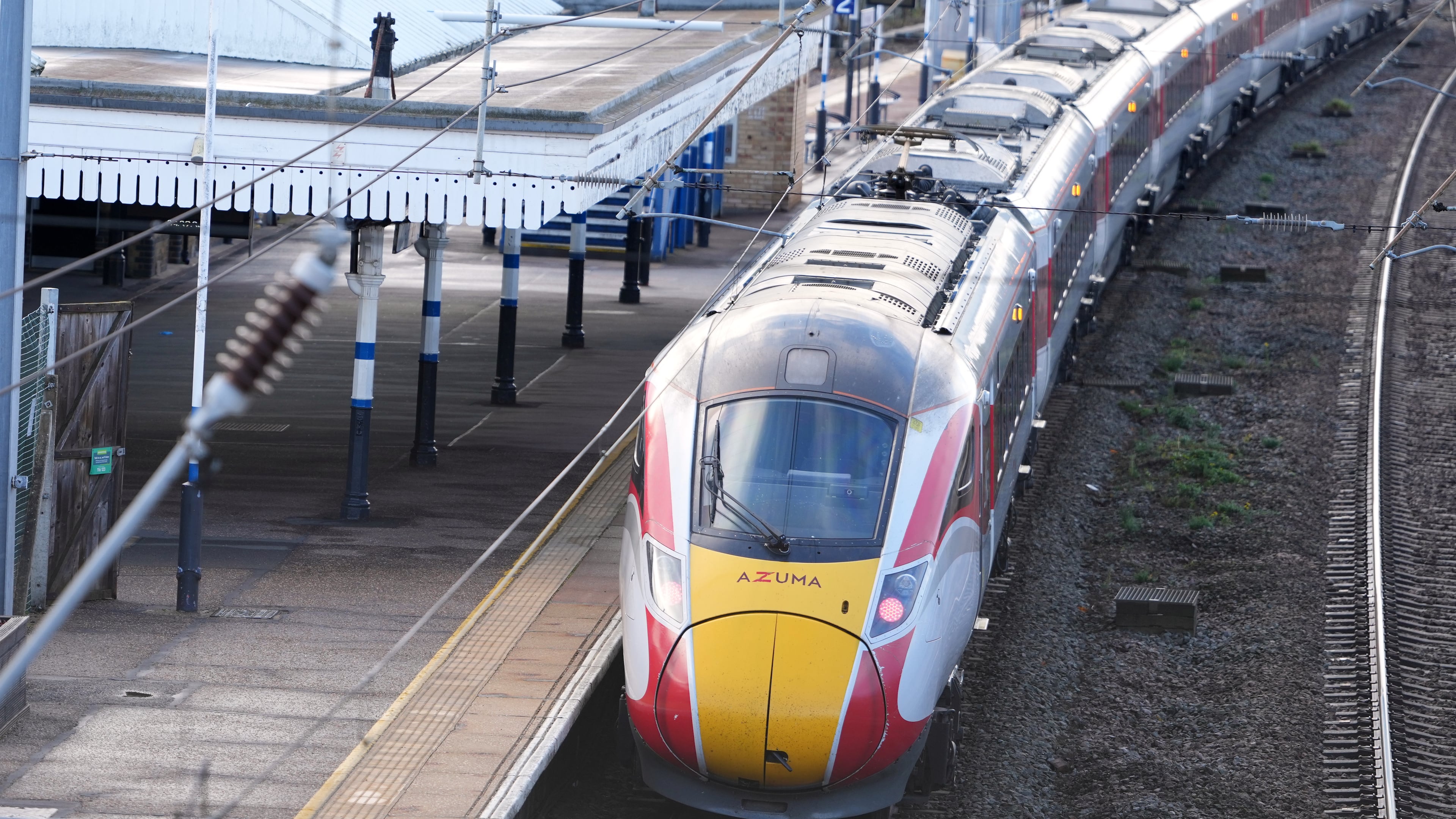 A train is parked at the station after a mass stabbing on a London-bound train in Huntingdon, England, Sunday, Nov. 2, 2025.(AP Photo/Kirsty Wigglesworth)
