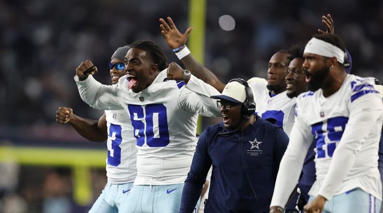 Dallas Cowboys offensive tackle Tyler Guyton (60) celebrates on the sideline after a two-point conversion against the New Orleans Saints during the second half of a preseason NFL football game, in Arlington, Texas, Friday, Aug. 28, 2026. (AP Photo/Gareth Patterson)