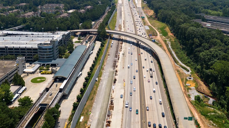 The Georgia Department of Transportation plans to build toll lanes on Ga. 400 in Fulton and Forsyth counties. It's one of several projects that will be delayed as GDOT reshuffles its construction timeline in metro Atlanta. Aerial photo shows Ga. 400 (L-Northbound, R-Southbound). North Springs MARTA station is shown on left. (File photo by Hyosub Shin / Hyosub.Shin@ajc.com)