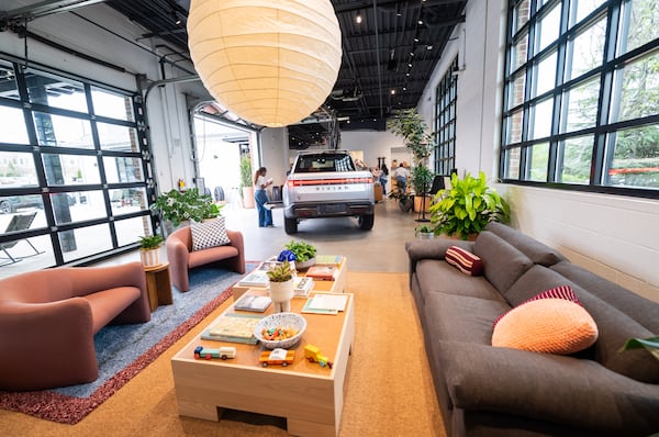 A Rivian R1T is seen adjacent to the lounge in the new Rivian “space” at Avalon in Alpharetta on Friday, April 4, 2025. 
(Bita Honarvar for The Atlanta Journal-Constitution)