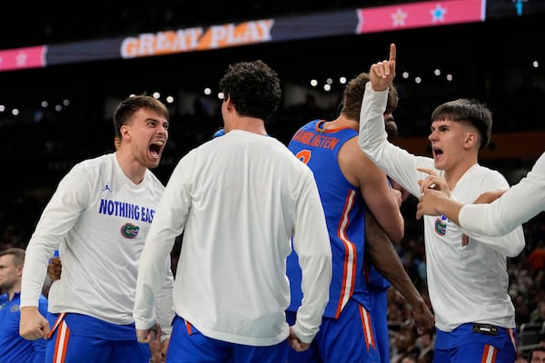Florida celebrates after scoring during the second half against Auburn in the national semifinals at the Final Four of the NCAA college basketball tournament, Saturday, April 5, 2025, in San Antonio. (AP Photo/Brynn Anderson)