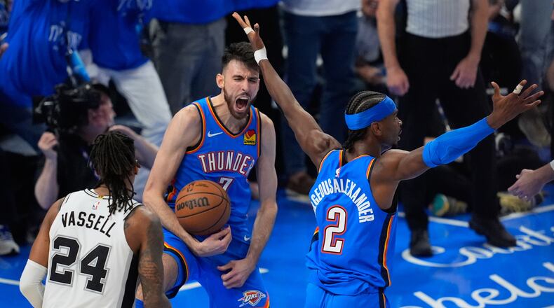 Oklahoma City Thunder center Chet Holmgren (7) celebrates with guard Shai Gilgeous-Alexander (2) after a dunk during the second half of Game 2 in the Western Conference finals NBA basketball playoffs series against the Oklahoma City Thunder Wednesday, May 20, 2026, in Oklahoma City. (AP Photo/Tony Gutierrez)