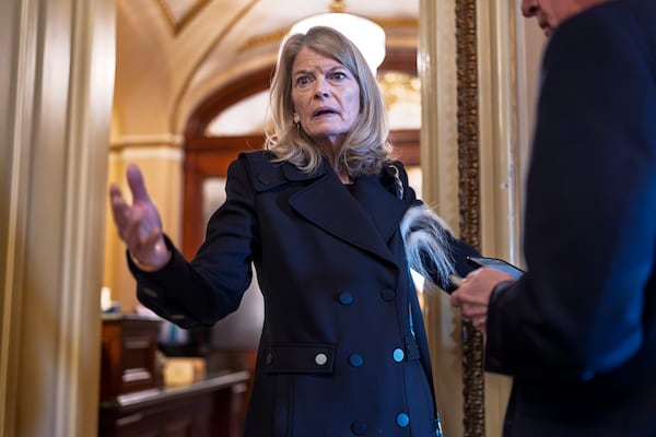 FILE - Sen. Lisa Murkowski, R-Alaska, a member of the Senate Appropriations Committee, pauses outside the chamber to answer a question from a reporter at the Capitol in Washington, March 14, 2025. (AP Photo/J. Scott Applewhite, File)