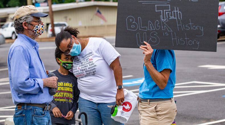 Teachers, parents and local residents gather to voice their opinions on critical race theory and what Cobb County teaching and the reviews initiated by the school board Thursday, June 10, 2021.  (Jenni Girtman for The Atlanta Journal Constitution)