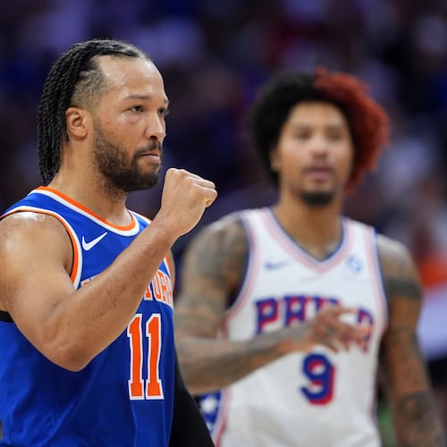 New York Knicks' Jalen Brunson, left, reacts past Philadelphia 76ers' Kelly Oubre Jr. during the first half of Game 3 in a second-round NBA basketball playoff series Friday, May 8, 2026, in Philadelphia. (AP Photo/Matt Slocum)
