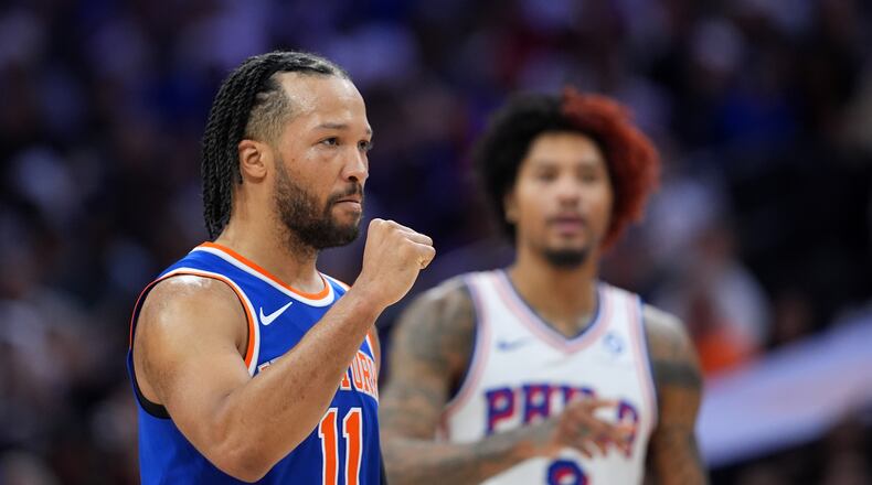 New York Knicks' Jalen Brunson, left, reacts past Philadelphia 76ers' Kelly Oubre Jr. during the first half of Game 3 in a second-round NBA basketball playoff series Friday, May 8, 2026, in Philadelphia. (AP Photo/Matt Slocum)