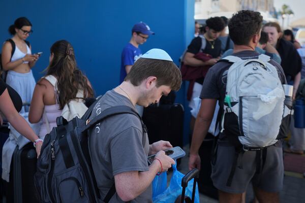Evacuees from Israel arrive at the port of Larnaca, Cyprus, Wednesday, June 18, 2025. (AP Photo/Petros Karadjias)