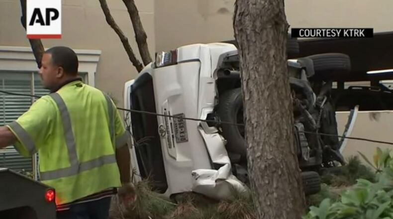 A SUV plunged off the third level of a parking garage in Houston Friday morning.