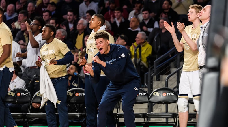 Georgia Tech forward Jordan Usher (middle, in navy sweats) has a body like a football player and an intensity level comparable to Tech point guard Jose Alvarado, strength-and-conditioning coach Dan Taylor said. "He's like a 6-foot-5, 225-pound version of Jose, is the best way I can describe it," Taylor said. (Danny Karnik/Georgia Tech Athletics)