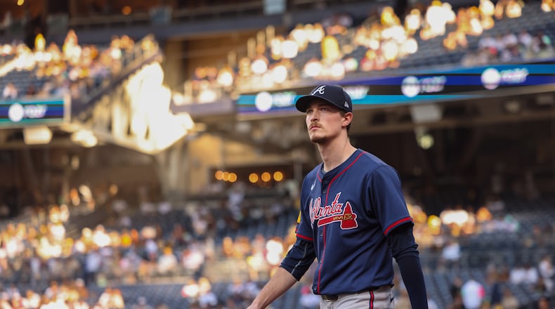 Early evening sunlight frames Atlanta Braves pitcher Max Fried (54) as he walks onto the field before National League Division Series Wild Card Game Two against the San Diego Padres at Petco Park in San Diego on Wednesday, Oct. 2, 2024. (Jason Getz / Jason.Getz@ajc.com)