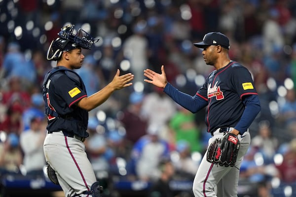 Atlanta Braves' Drake Baldwin, left, and Raisel Iglesias celebrate after the Braves won the second baseball game of a doubleheader against the Philadelphia Phillies Thursday, May 29, 2025, in Philadelphia. (AP Photo/Matt Slocum)