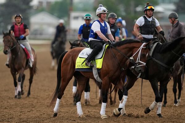 Kentucky Derby entrant Journalism comes off the track after a workout at Churchill Downs Tuesday, April 29, 2025, in Louisville, Ky. (AP Photo/Charlie Riedel)