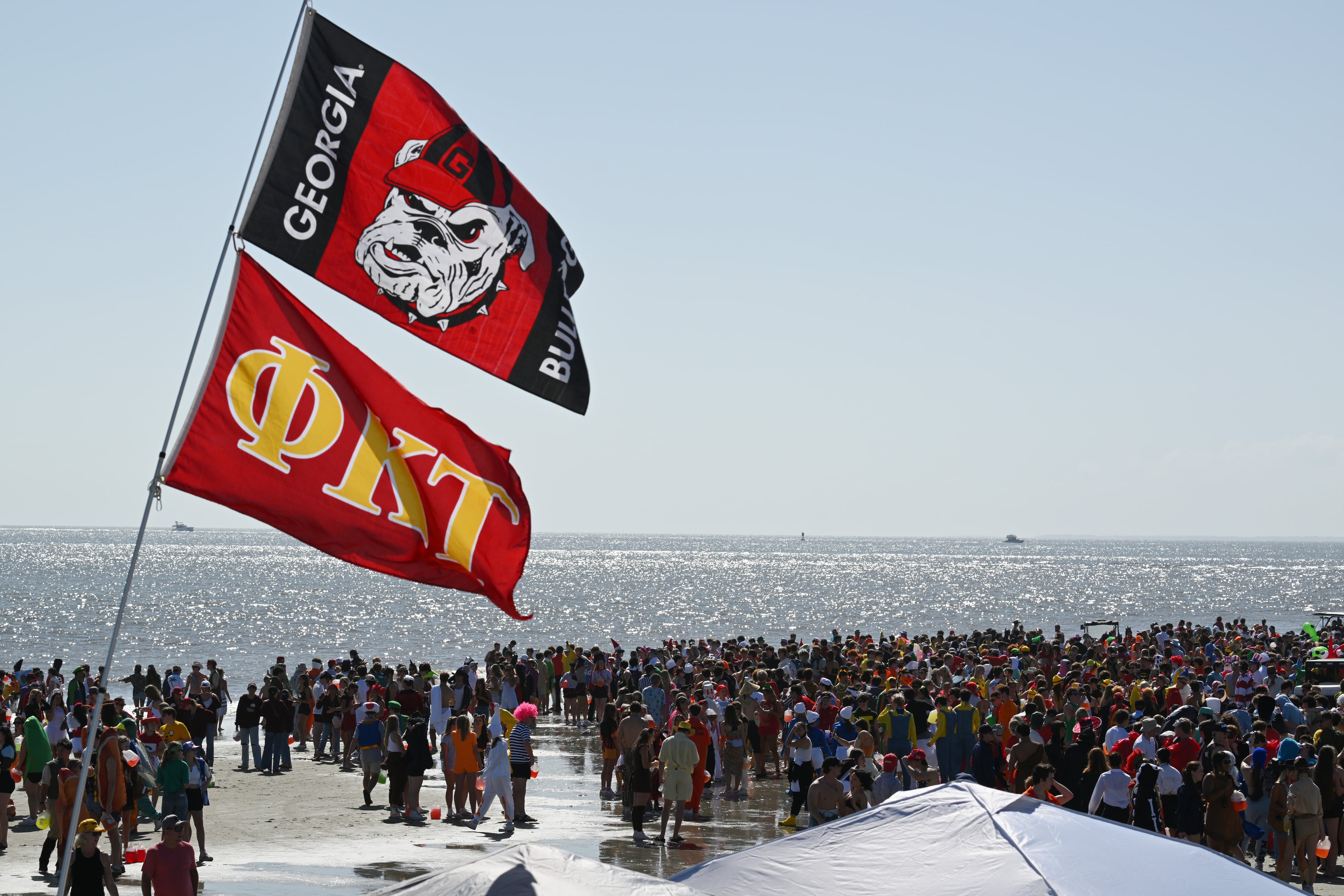 Thousands of UGA students gather during the annual “Frat Beach” party for the weekend of the Georgia-Florida football game on St. Simons Island, Friday, November 1, 2024. On the weekend of the Georgia-Florida football game, St. Simons Island’s East Beach becomes “Frat Beach,” an open-air party teeming with thousands of college students. (Hyosub Shin / AJC)