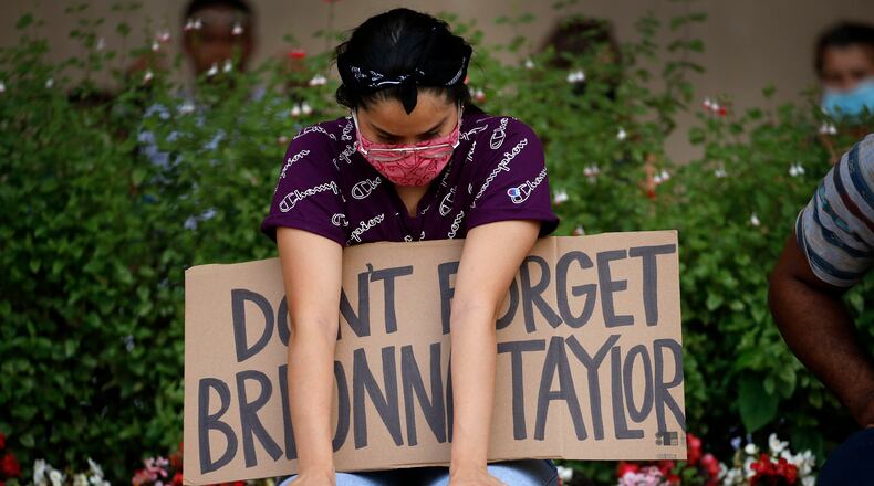 A protester remembering Breonna Taylor listens to a Black Lives Matters rally at City Hall in Dallas on Wednesday, June 3, 2020. Taylor was fatally shot by police officers in Louisville, Ky.