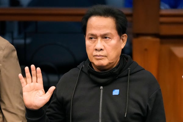FILE - Apollo Quiboloy takes his oath as he attends a hearing at the Philippine Senate on Oct. 23, 2024, in Manila, Philippines. (AP Photo/Aaron Favila, file)