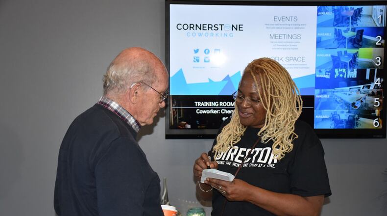 Cheryle Moses greets attendee Niall Mathieson at the first Come Meet a Black Person networking event held in November. Contributed