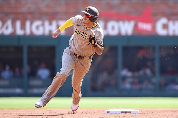 San Diego Padres' Manny Machado rounds second base in the first inning of a baseball game against the Atlanta Braves, Saturday, May 24, 2025, in Atlanta. (AP Photo/Colin Hubbard)