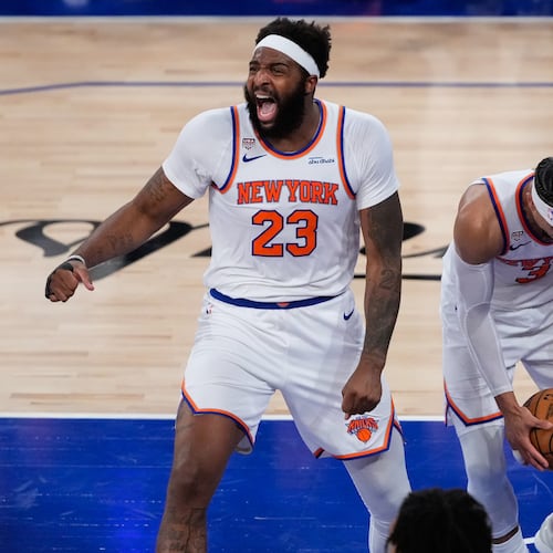 New York Knicks center Mitchell Robinson (23) and guard Josh Hart (3) celebrate after Game 4 of the NBA Finals basketball series against the San Antonio Spurs, Wednesday, June 10, 2026, in New York. (AP Photo/Ross D. Franklin)