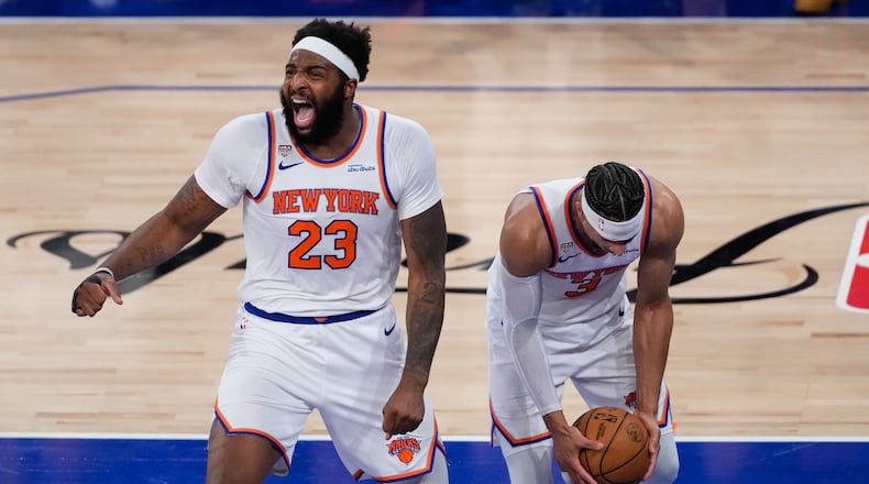 New York Knicks center Mitchell Robinson (23) and guard Josh Hart (3) celebrate after Game 4 of the NBA Finals basketball series against the San Antonio Spurs, Wednesday, June 10, 2026, in New York. (AP Photo/Ross D. Franklin)