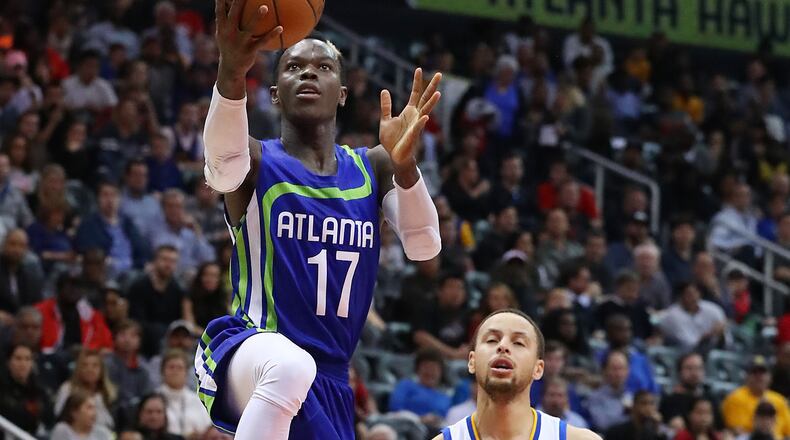 Atlanta Hawks guard Dennis Schroder takes it to the basket past Golden State Warriors guard Stephen Curry for two of his 19 first period points in a NBA basketball game on Monday, March 6, 2017, in Atlanta. Curtis Compton/ccompton@ajc.com