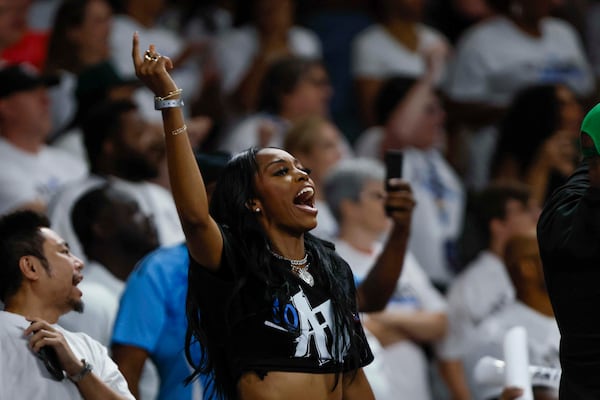 An Atlanta Dream fan cheers during the second half of a WNBA basketball first-round playoff game at Gateway Center Arena on Sunday, Sept. 14, 2024, in Atlanta.
(Miguel Martinez/AJC)