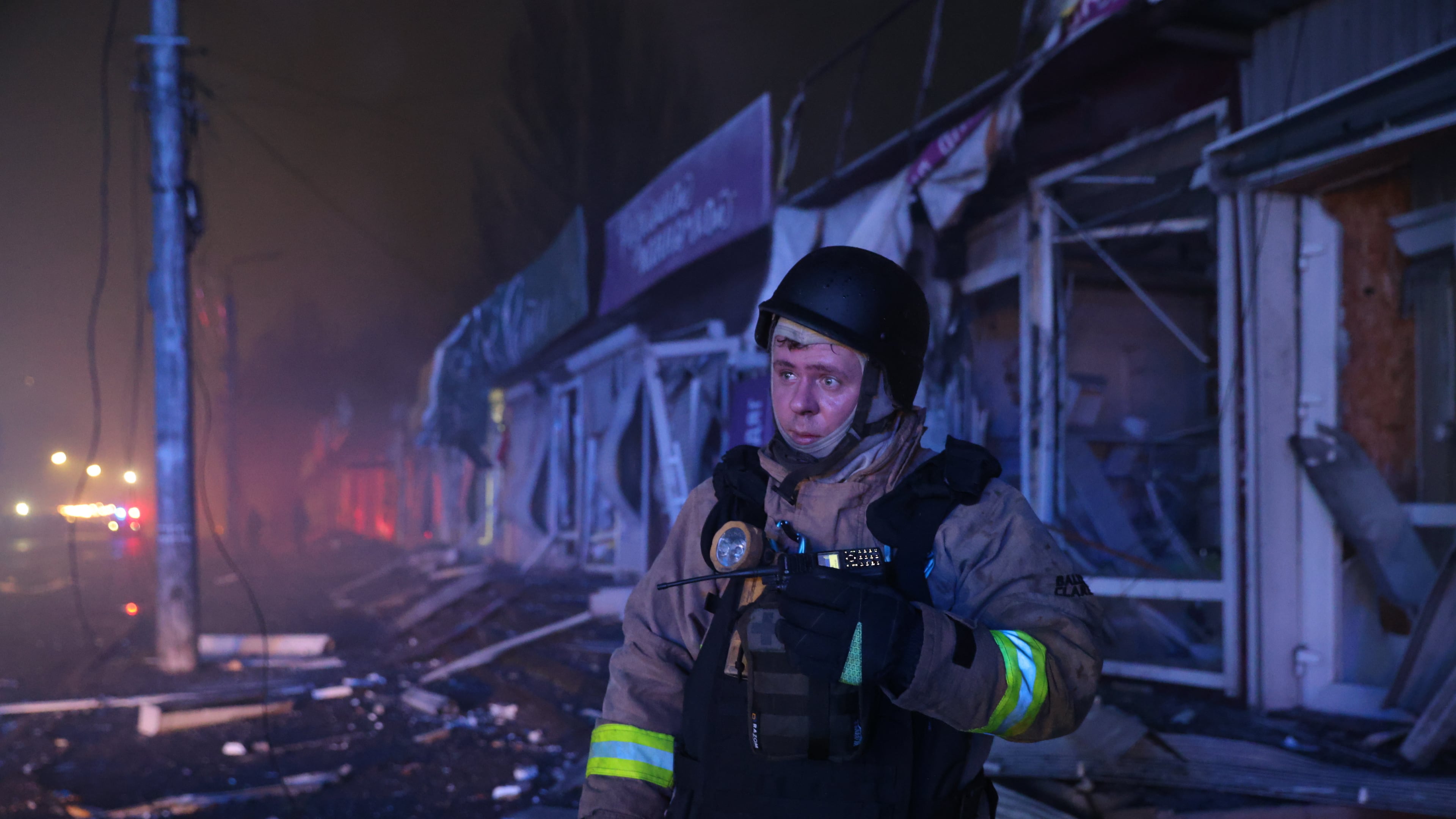 A rescuer works at a market destroyed by a Russian airstrike on Zaporizhzhia, Ukraine, Friday, Nov. 21, 2025. (AP Photo/Kateryna Klochko)