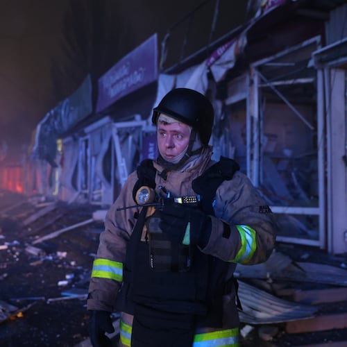 A rescuer works at a market destroyed by a Russian airstrike on Zaporizhzhia, Ukraine, Friday, Nov. 21, 2025. (AP Photo/Kateryna Klochko)