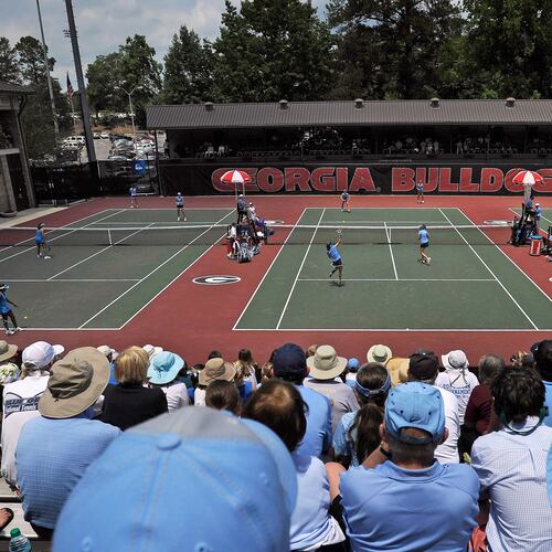FILE - Spectators crowd center court at the Dan Magill Tennis Complex during the UCLA and North Carolina women's doubles match in the NCAA Division I tennis championships, May 20, 2014, in Athens, Ga. (AP Photo/David Tulis, File)
