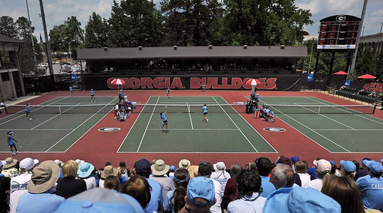 FILE - Spectators crowd center court at the Dan Magill Tennis Complex during the UCLA and North Carolina women's doubles match in the NCAA Division I tennis championships, May 20, 2014, in Athens, Ga. (AP Photo/David Tulis, File)