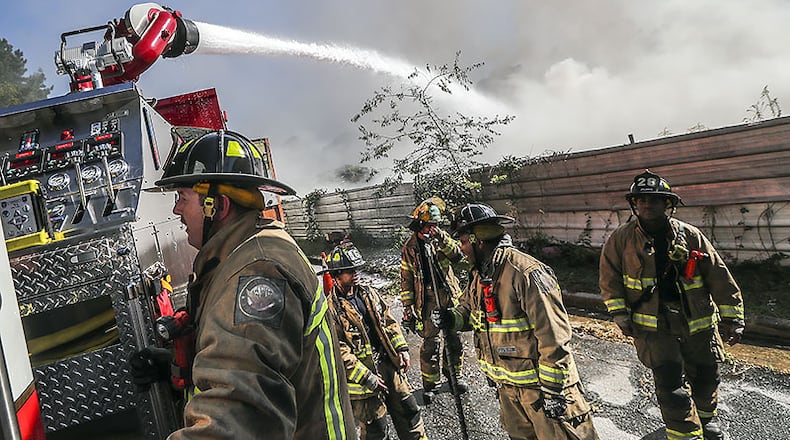 Fire crews battled a massive blaze at a northwest Atlanta salvage yard on Monday, Sept. 23, 2019, officials said.
